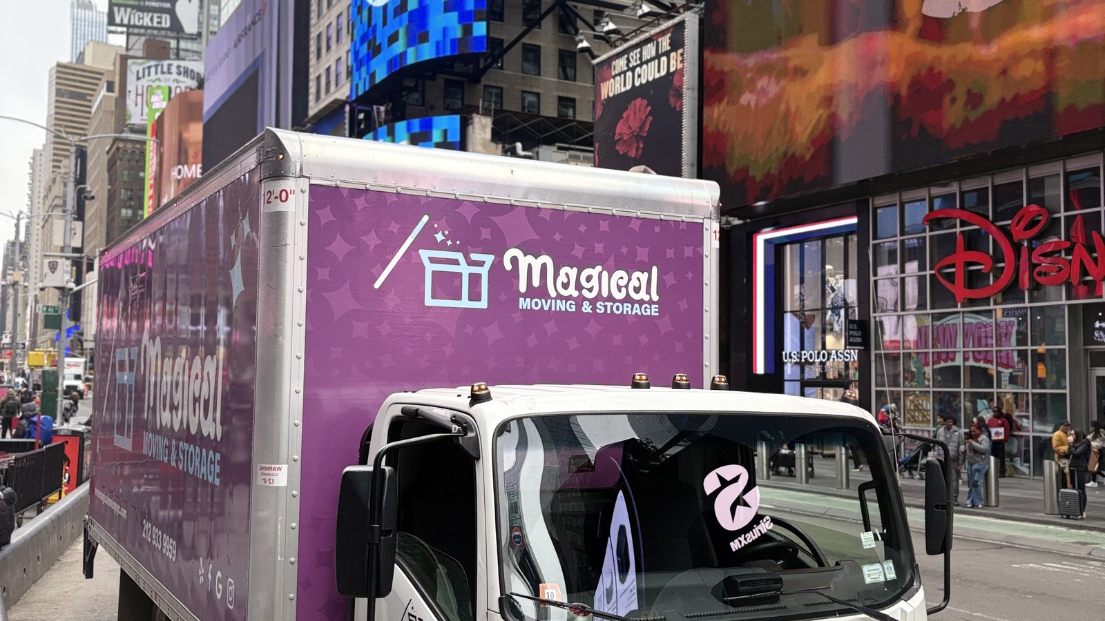 Magical Moving & Storage truck in Times Square, NYC, ready for a Manhattan high-rise move