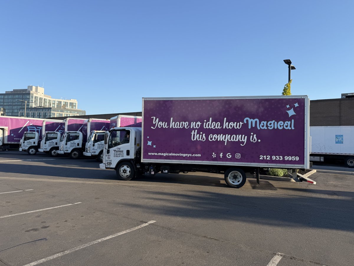 Summer moving in NYC: Magical Moving & Storage branded truck and fleet on a sunny day