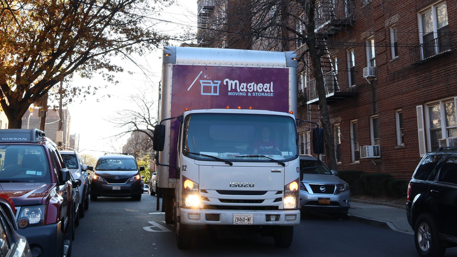 Magical Moving truck on a NYC residential street during a college move-in