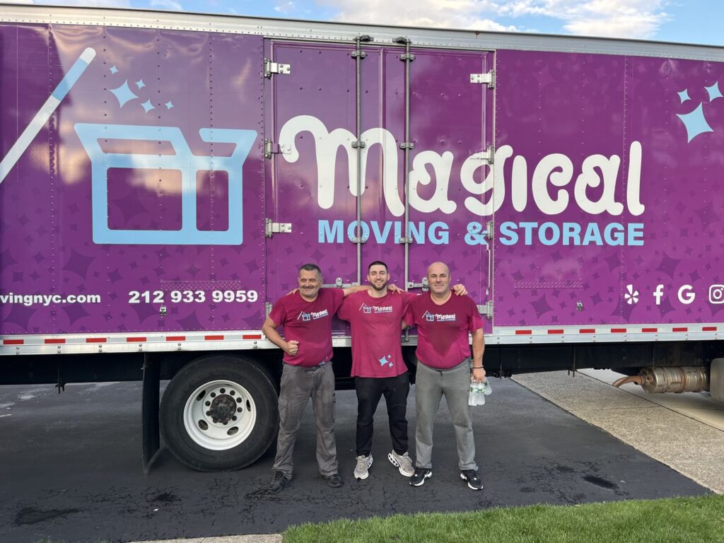 Magical Moving crew standing in front of a Magical Moving and Storage truck