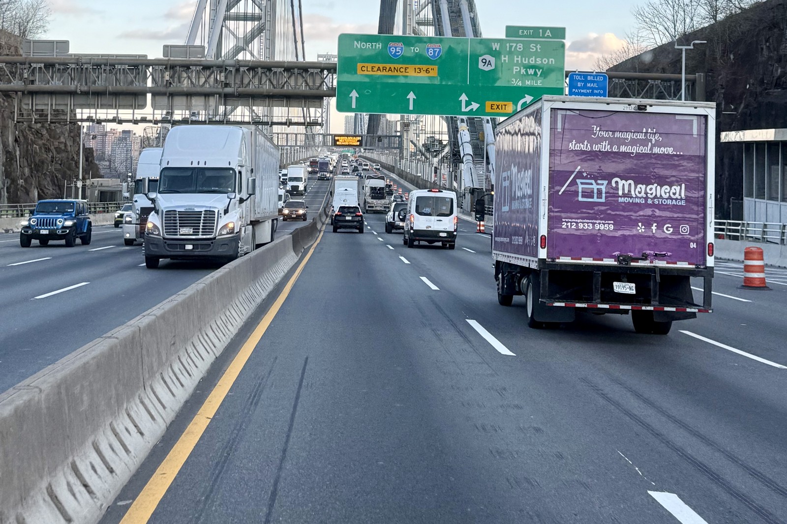 moving from NYC to Boston: Magical Moving truck leaving the city on the George Washington Bridge